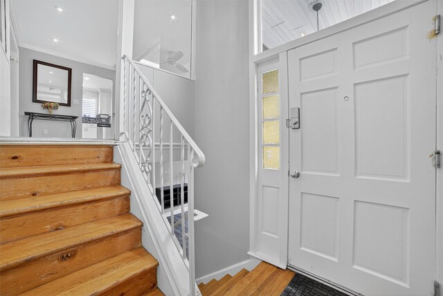 7 Fuller Rd, Ossining, NY 10562 - foyer entrance featuring stairway, crown molding, and wood finished floors
