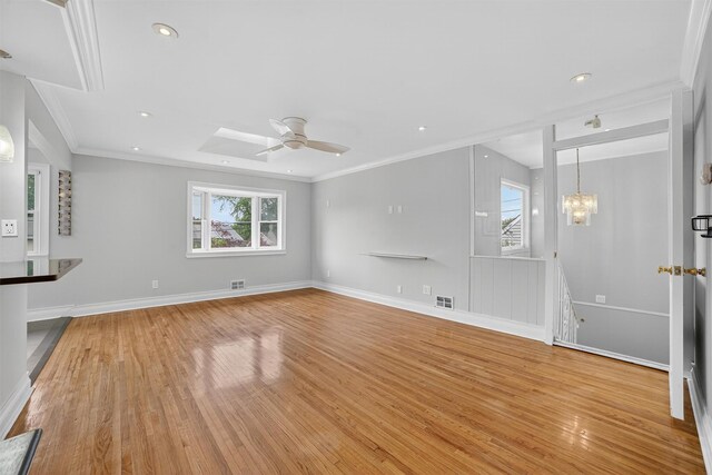 7 Fuller Rd, Ossining, NY 10562 - unfurnished living room featuring light wood finished floors, crown molding, ceiling fan, a chandelier, and recessed lighting