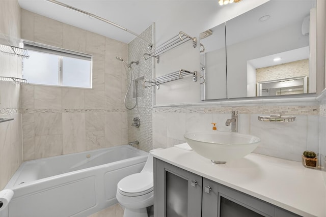 7 Fuller Rd, Ossining, NY 10562 - full bathroom with tile walls, vanity, and shower / bathtub combination