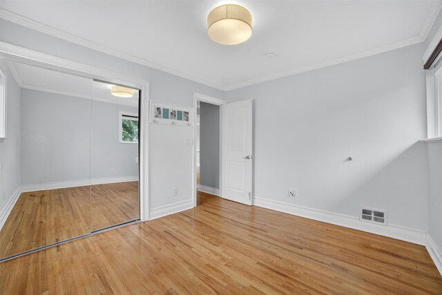 7 Fuller Rd, Ossining, NY 10562 - unfurnished bedroom with light wood finished floors, a closet, and crown molding
