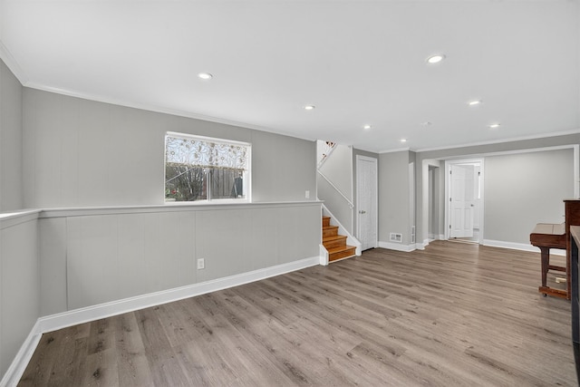 7 Fuller Rd, Ossining, NY 10562 - spare room featuring ornamental molding, stairway, wood finished floors, and recessed lighting
