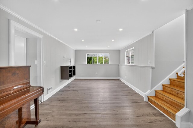 7 Fuller Rd, Ossining, NY 10562 - unfurnished living room featuring crown molding, wood finished floors, stairs, and recessed lighting