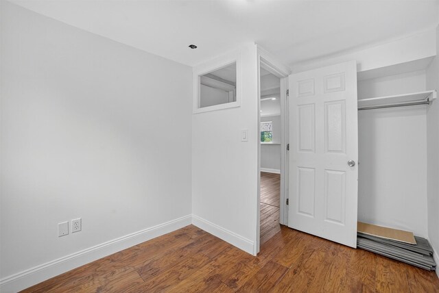 7 Fuller Rd, Ossining, NY 10562 - unfurnished bedroom with wood finished floors and a closet