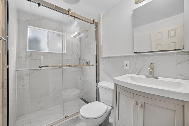 7 Fuller Rd, Ossining, NY 10562 - full bathroom featuring tile walls, a marble finish shower, and vanity
