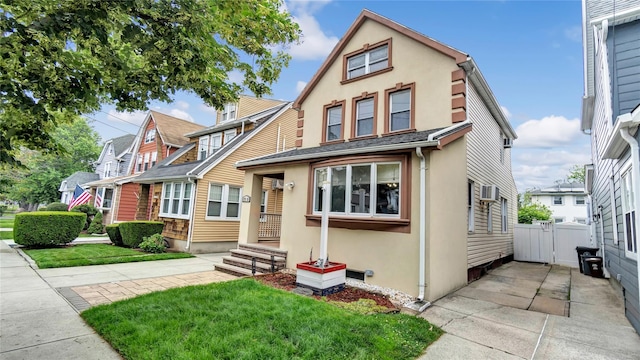 17111 Bagley Ave, Flushing, NY 11358 - view of front facade featuring stucco siding and a gate