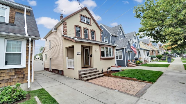 17111 Bagley Ave, Flushing, NY 11358 - view of front facade featuring stucco siding and a residential view