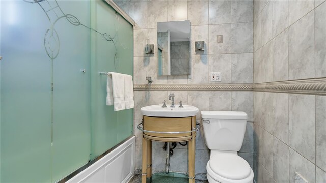 17111 Bagley Ave, Flushing, NY 11358 - bathroom with shower / bath combination with glass door and tile walls