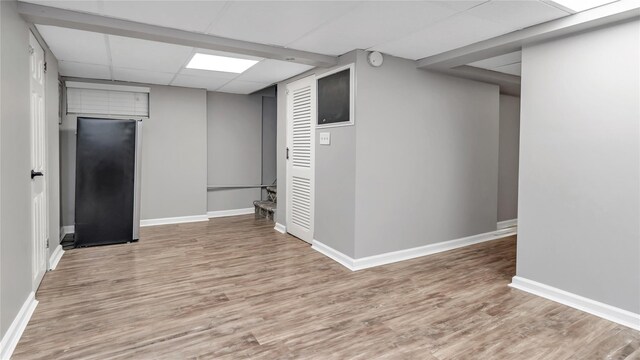 17111 Bagley Ave, Flushing, NY 11358 - finished basement featuring wood finished floors and a paneled ceiling
