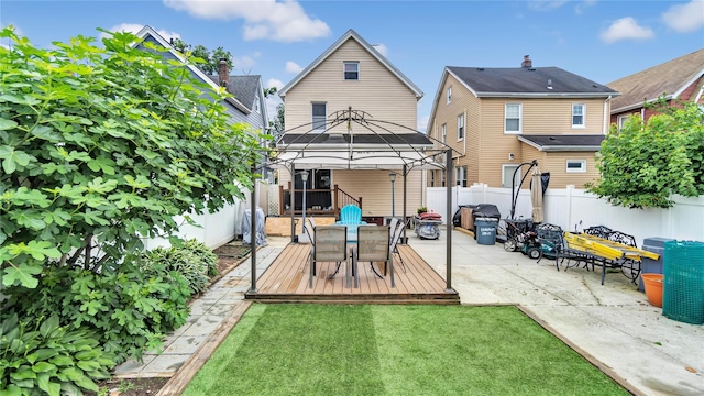 17111 Bagley Ave, Flushing, NY 11358 - back of property with a gazebo, outdoor dining space, a fenced backyard, and a patio