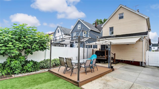 17111 Bagley Ave, Flushing, NY 11358 - back of property with a wooden deck, a fenced backyard, outdoor dining space, and a patio area