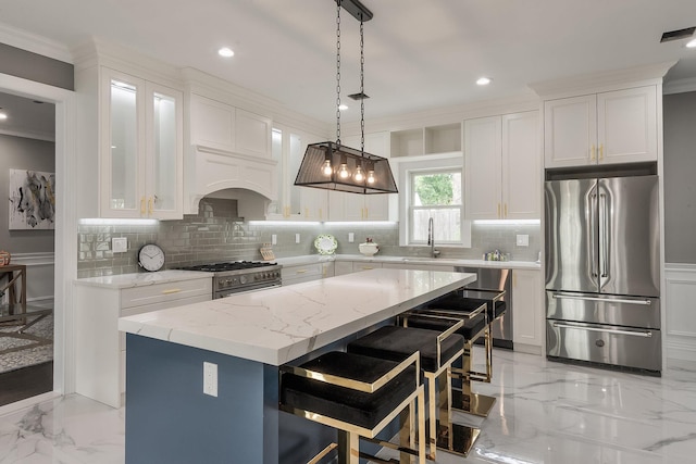 2040 Wellington Ct, Westbury, NY 11590 - kitchen with stainless steel appliances, light marble finish flooring, decorative backsplash, crown molding, and white cabinets