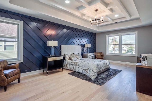 2040 Wellington Ct, Westbury, NY 11590 - bedroom featuring a chandelier, multiple windows, light wood finished floors, coffered ceiling, and recessed lighting