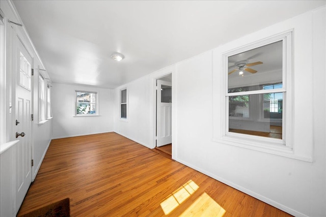 65 Schmeelk Pl, Copiague, NY 11726 - unfurnished room with wood finished floors and a ceiling fan