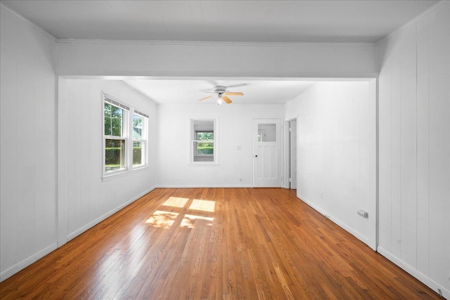 65 Schmeelk Pl, Copiague, NY 11726 - spare room featuring wood finished floors, a ceiling fan, and crown molding