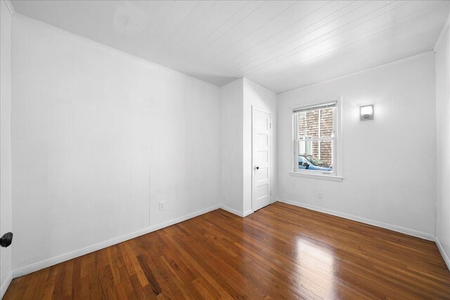 65 Schmeelk Pl, Copiague, NY 11726 - spare room featuring wood finished floors and ornamental molding