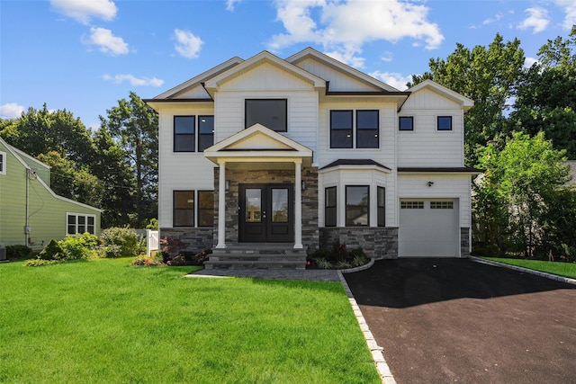 19 Cypress Ave, Bethpage, NY 11714 - view of front of home featuring french doors, stone siding, asphalt driveway, and a front lawn