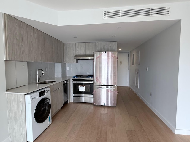 136-80 41st Ave Unit 6G, Flushing, NY 11355 - kitchen featuring washer / dryer, stainless steel appliances, modern cabinets, range hood, and recessed lighting