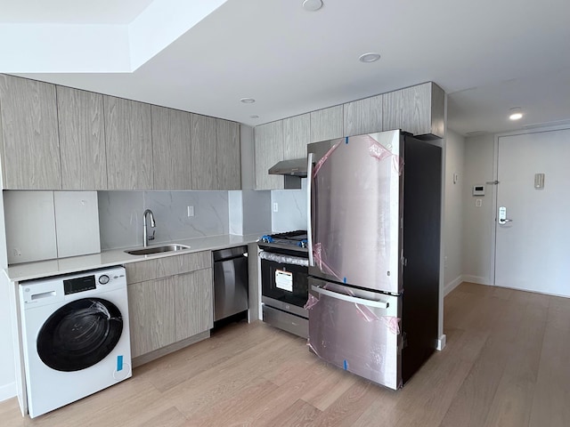 136-80 41st Ave Unit 6G, Flushing, NY 11355 - kitchen with stainless steel appliances, washer / clothes dryer, exhaust hood, light wood-type flooring, and light countertops