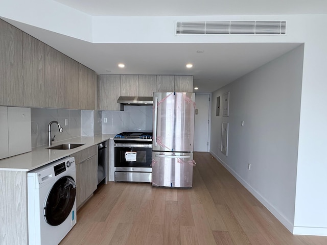 136-80 41st Ave Unit 6G, Flushing, NY 11355 - kitchen with appliances with stainless steel finishes, washer / clothes dryer, range hood, modern cabinets, and recessed lighting