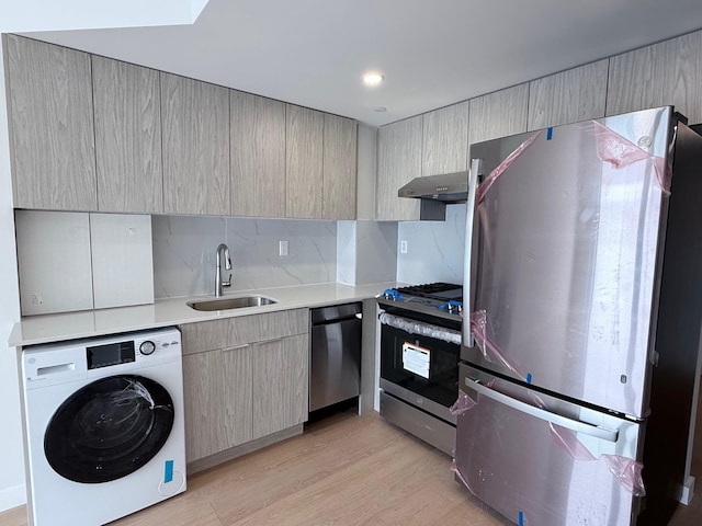 136-80 41st Ave Unit 6G, Flushing, NY 11355 - kitchen featuring stainless steel appliances, washer / dryer, extractor fan, light countertops, and light wood-type flooring
