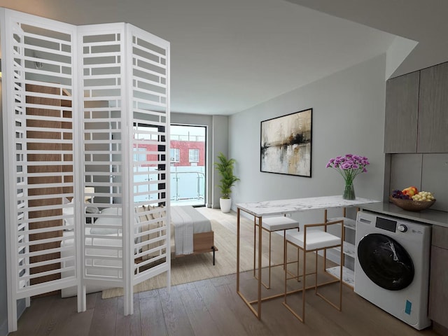 136-80 41st Ave Unit 6G, Flushing, NY 11355 - laundry area with washer / clothes dryer and wood finished floors