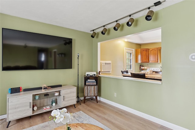 18 Berkeley Ave, Selden, NY 11784 - living area with wood finished floors, a wall mounted AC, and track lighting