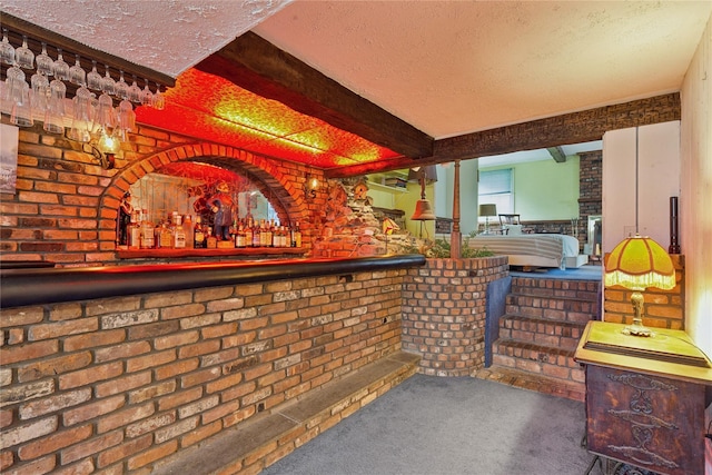18 Berkeley Ave, Selden, NY 11784 - indoor dry bar featuring carpet floors, a textured ceiling, and brick wall