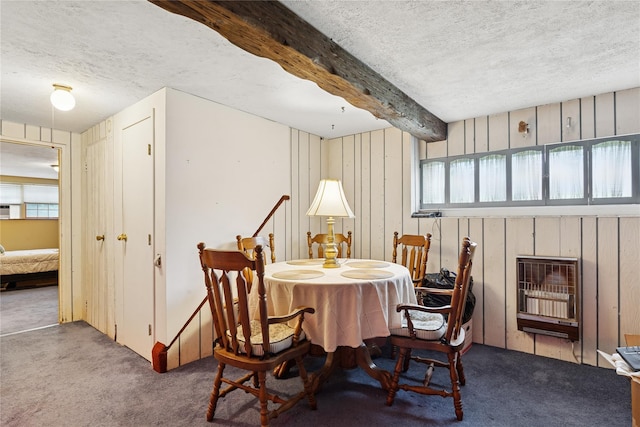 18 Berkeley Ave, Selden, NY 11784 - carpeted dining area with heating unit, plenty of natural light, a textured ceiling, beam ceiling, and wood walls