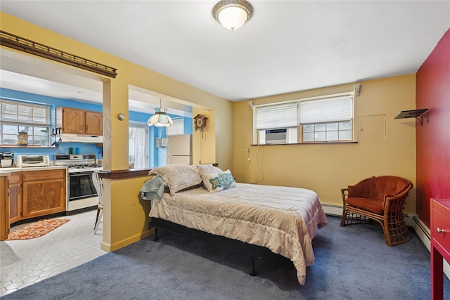 18 Berkeley Ave, Selden, NY 11784 - bedroom with multiple windows, freestanding refrigerator, and baseboard heating
