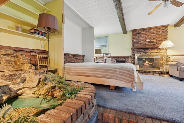 18 Berkeley Ave, Selden, NY 11784 - carpeted bedroom featuring a fireplace, beam ceiling, and a ceiling fan