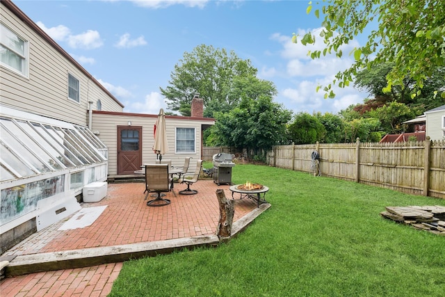 18 Berkeley Ave, Selden, NY 11784 - fenced backyard featuring a fire pit and a patio