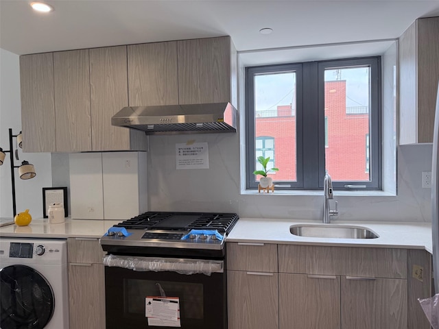 136-80 41st Ave Unit 6H, Flushing, NY 11355 - kitchen featuring stainless steel gas range oven, washer / clothes dryer, ventilation hood, light countertops, and modern cabinets