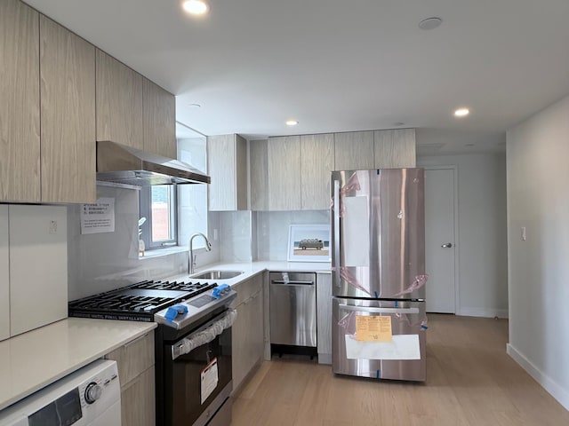 136-80 41st Ave Unit 6H, Flushing, NY 11355 - kitchen featuring appliances with stainless steel finishes, wall chimney range hood, modern cabinets, light countertops, and recessed lighting