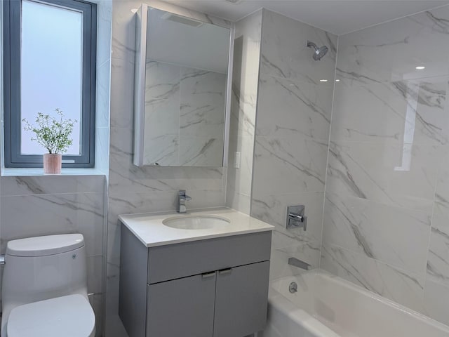 136-80 41st Ave Unit 6H, Flushing, NY 11355 - bathroom with vanity, washtub / shower combination, and tile walls