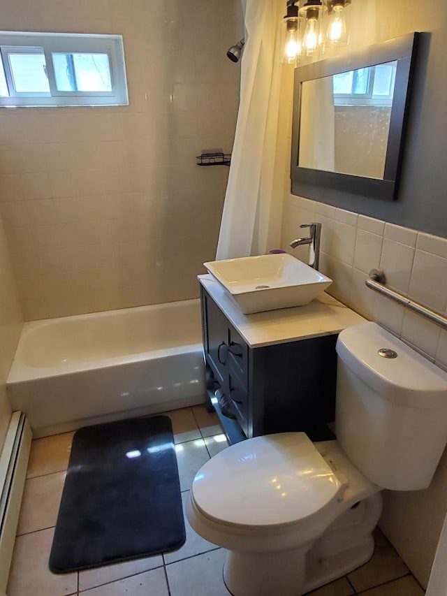 50 Cliff Ln, Levittown, NY 11756 - bathroom featuring a baseboard heating unit, shower / bathtub combination with curtain, vanity, tile patterned floors, and tile walls