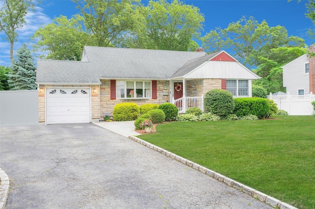15 Peony Ln, Commack, NY 11725 - view of front of property with stone siding, a garage, driveway, a chimney, and a shingled roof