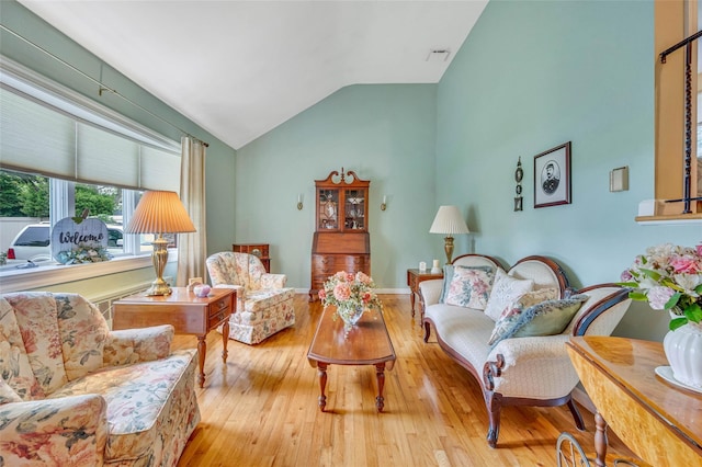 15 Peony Ln, Commack, NY 11725 - living room with vaulted ceiling and wood-type flooring