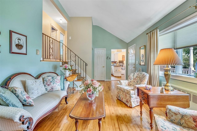 15 Peony Ln, Commack, NY 11725 - living room with hardwood / wood-style floors, stairway, and vaulted ceiling