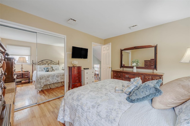 15 Peony Ln, Commack, NY 11725 - bedroom with light wood finished floors and a closet
