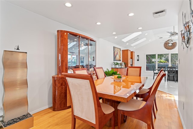 128 Seaman Rd, Jericho, NY 11753 - dining area featuring ceiling fan, recessed lighting, light wood finished floors, lofted ceiling, and a skylight