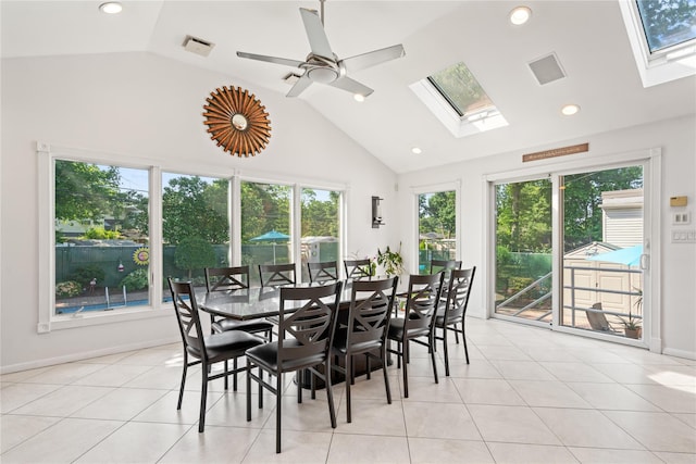 128 Seaman Rd, Jericho, NY 11753 - dining space with a skylight, high vaulted ceiling, light tile patterned floors, ceiling fan, and recessed lighting