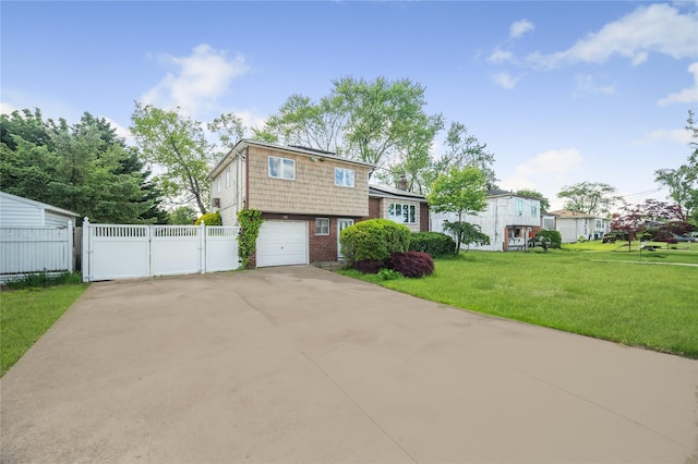 38 W 17th St, Deer Park, NY 11729 - split level home with a gate, driveway, a garage, and brick siding