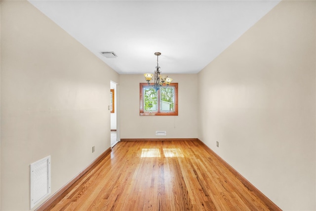 38 W 17th St, Deer Park, NY 11729 - unfurnished room featuring a chandelier and light wood finished floors