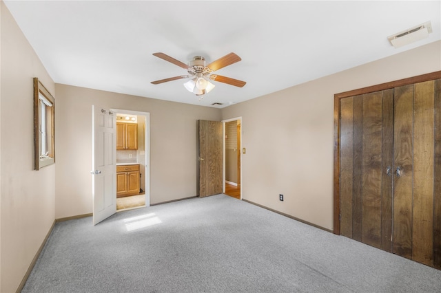 38 W 17th St, Deer Park, NY 11729 - unfurnished bedroom with light carpet, ceiling fan, and connected bathroom