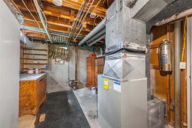 38 W 17th St, Deer Park, NY 11729 - utility room featuring heating unit