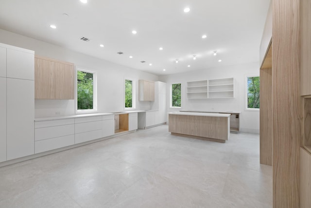 15 Gilda Ct, Spring Valley, NY 10977 - kitchen with modern cabinets, open shelves, plenty of natural light, a center island, and recessed lighting
