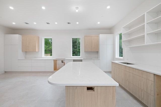 15 Gilda Ct, Spring Valley, NY 10977 - kitchen featuring modern cabinets, light brown cabinetry, recessed lighting, a center island, and open shelves