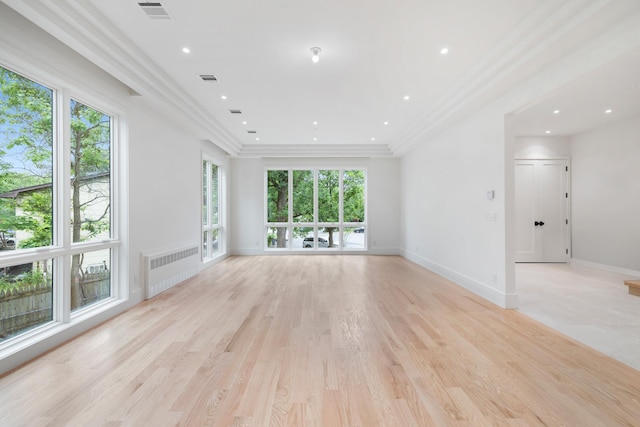15 Gilda Ct, Spring Valley, NY 10977 - unfurnished living room featuring radiator, crown molding, and light wood finished floors