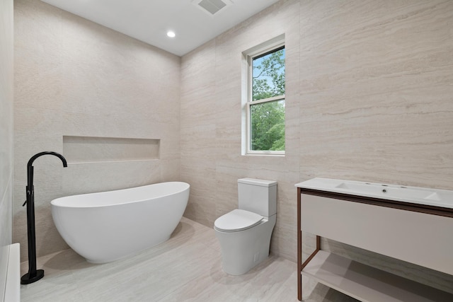 15 Gilda Ct, Spring Valley, NY 10977 - full bathroom with a soaking tub, tile walls, vanity, and recessed lighting
