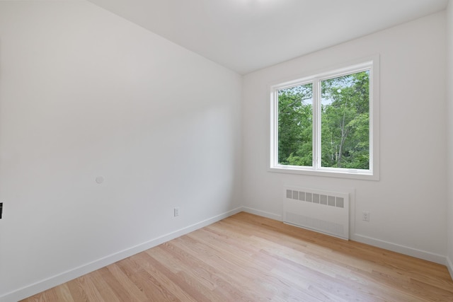 15 Gilda Ct, Spring Valley, NY 10977 - spare room featuring radiator and light wood-type flooring
